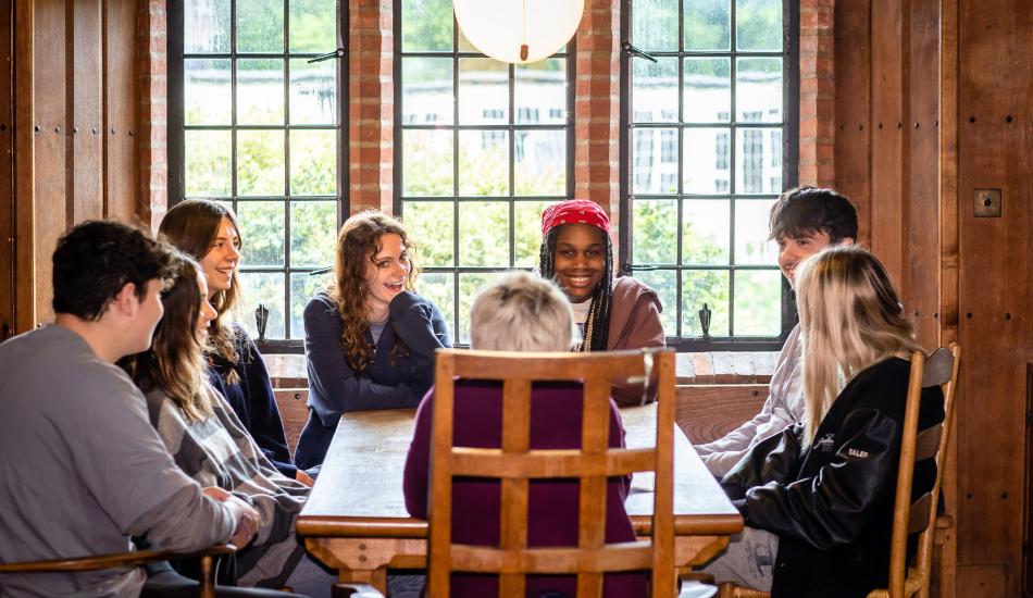 Bedales Senior students in discussion with a teacher in the Memorial Library