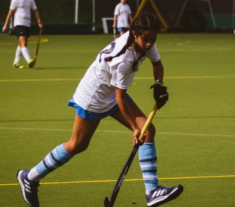 Bedales student playing hockey