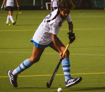 Bedales student playing hockey