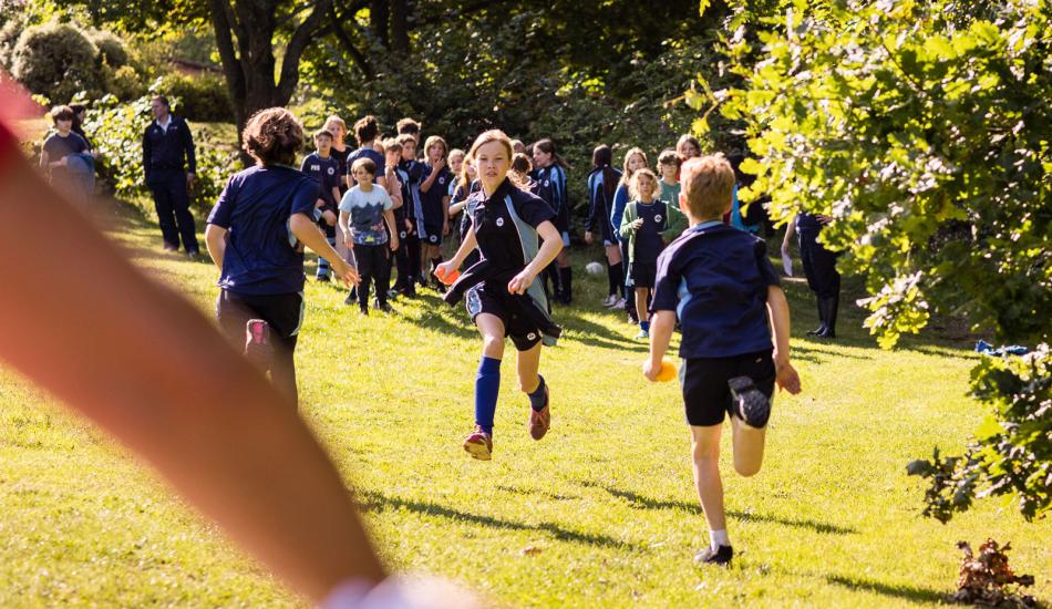 Kids running in school field