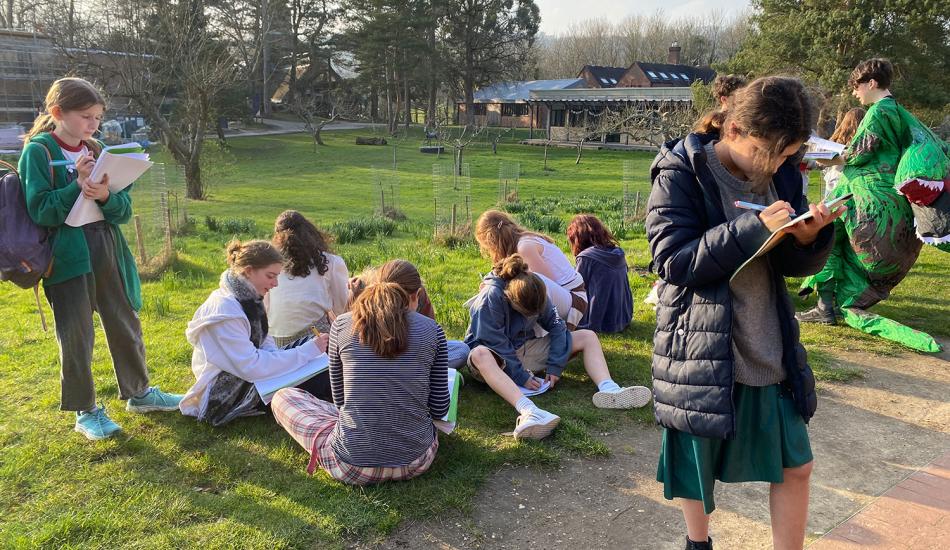 Bedales students taking part in a creative writing workshop in the Orchard