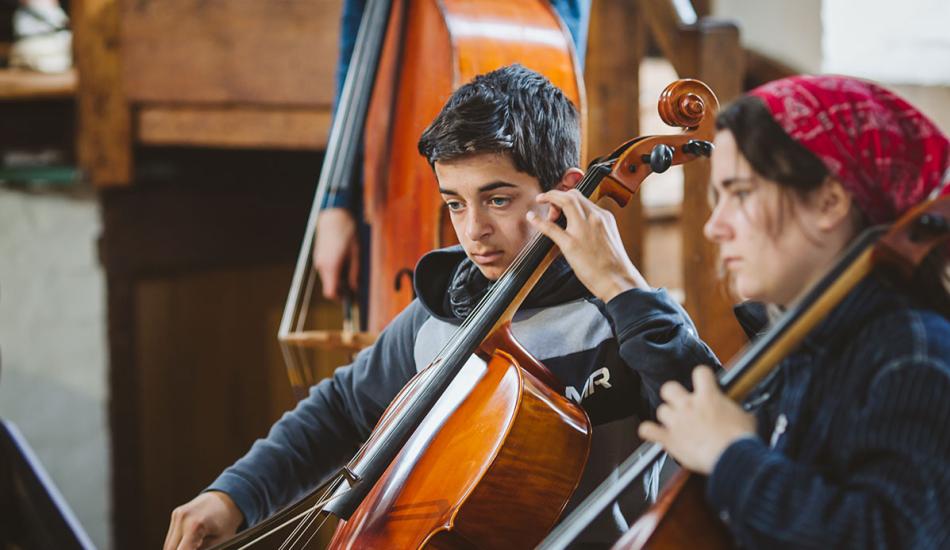 Bedales student playing cello in classical concert